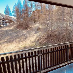 a view out of a window of a forest at Studio Vitalis in Zermatt