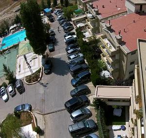 an overhead view of a parking lot with cars parked at 2-Bedroom Chalet for Ski and Summer in Kfardebian