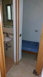 a bathroom with a sink and a bench in it at 2-Bedroom Chalet for Ski and Summer in Kfardebian +5 photos