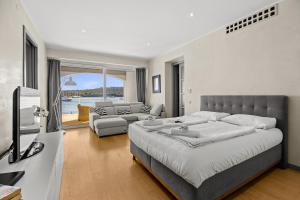 a bedroom with a large bed and a living room at Villa Laura in Pula +38 photos