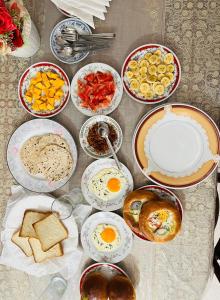 a table topped with bowls and plates of food at Royal Villa in Ahangama