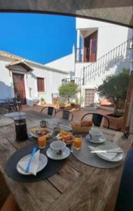 a wooden table with food on top of it at Casa d´Alte in Alte