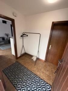 a room with a door and a stand on the floor at Appolo in Vouvry