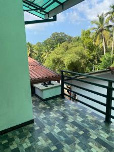 a view from the balcony of a house at Chandani Hostel in Galle