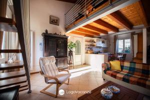 a living room with a couch and a fireplace at Appartamento Diana in Salò