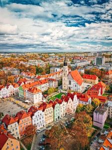 an aerial view of a city with red roofs at Pottery Town Center Apartment in Bolesławiec