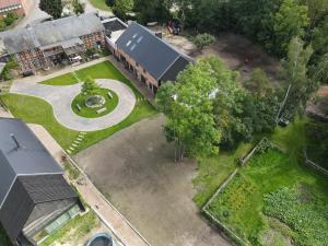 an overhead view of a building with a courtyard with a fountain at ASTRAEA Jurt Village in Arendsee