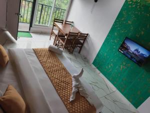 a living room with a dog on the floor at Hill view cottage cj in Devikolam