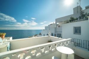a balcony with a view of the ocean at Le Contrade Di San Salvatore in Monopoli
