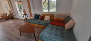 a living room with a couch and a table at YonShala in Garrosse