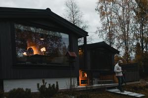 a man standing in front of a tiny house at Ådalsvollen Retreat -Go Wild for a While, Private Nature Getaway in Verdal +30 photos