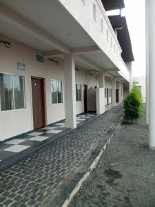 an empty building with a black and white checkered floor at Amol resort in Vidisha
