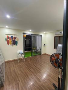 a living room with a hard wood floor at Homestay Lumina in Dong Hoi
