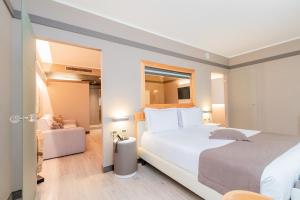 a bedroom with a large white bed in a room at Park Hotel Ai Pini & Restaurant Ai Pini in Mestre