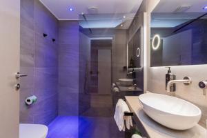 a bathroom with a white sink and a shower at Park Hotel Ai Pini & Restaurant Ai Pini in Mestre