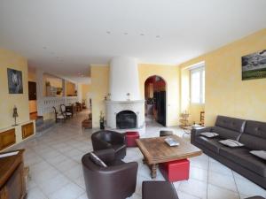a living room with a couch and a fireplace at VOIRIN Valérie in Cramant +2 photos