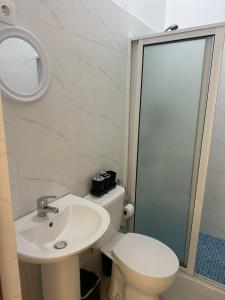a bathroom with a toilet and a sink and a mirror at Casa de Mel&Niky in Paul