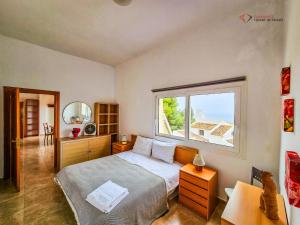 a bedroom with a bed and a large window at Diamante Villa Mijas in Mijas +32 photos