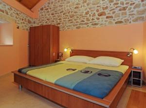 a bedroom with a large bed in a room at Menego Lodge Bol in Bol