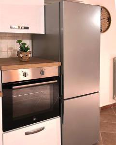 a stainless steel refrigerator in a kitchen at Residence Il Casolare in Piedimonte San Germano