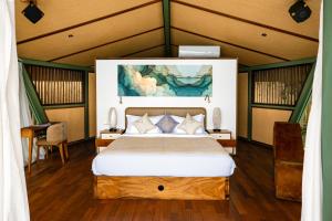 a bedroom with a bed in a room at Kama Haven in Semaya