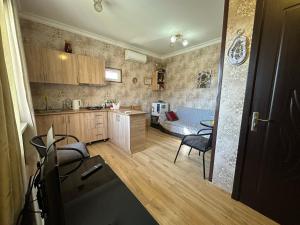 a kitchen with a table and a dining room at Amiran's Lake in Tbilisi City