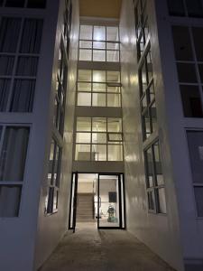 a hallway of an office building at night at E&J Solace Studio Mactan Bayanihan Flats 2 in Maribago