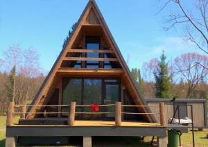 a frame cabin with a thatched roof at 3A-CHALET-LIBaN in Liban