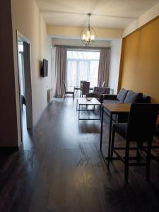 a living room with a couch and chairs and a table at Kechi House Jaklin in Tsaghkadzor