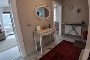 a room with a table and a mirror on the wall at Vinland Villa Atalar in Trabzon +53 photos