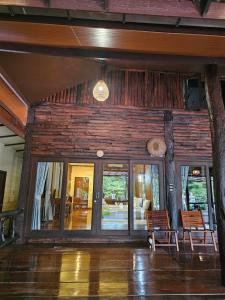 a lobby of a house with glass doors at The Mangrove Hideaway Kohchang in Ko Chang