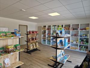 a store room with shelves filled with food at Camping La Provençale - Maeva in Mandelieu-La Napoule
