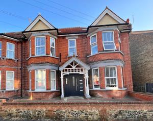a red brick house with a black door at Margate Duplex with Private Terrace Air Conditioning The Duplex Margate in Margate