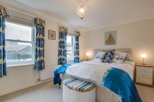 a bedroom with a bed and a large window at 2 Bed in Seaton oc-mbtuc in Seaton