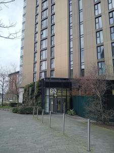 a large building with a sign in front of it at Apartment 3 in Birmingham