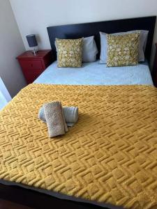a large bed with two pillows on top of it at Sea View Andrade 3 Bedroom House in Gaula