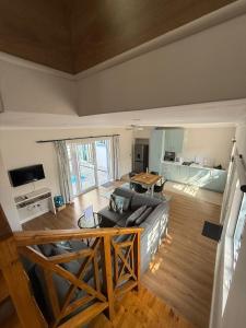 a living room with a couch and a table at Ocean Whisper in Plettenberg Bay