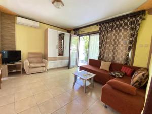 a living room with a couch and a chair at Fran in Crikvenica
