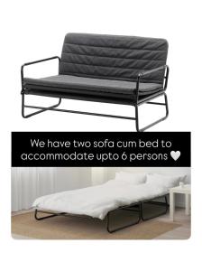 a bed with a black frame in a room at Casa Zo an entire fully furnished apartment in Āīzawl
