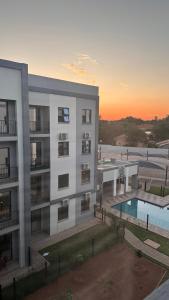 an aerial view of a apartment building with a swimming pool at The F402 Residence in Gaborone