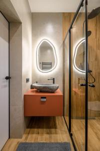 a bathroom with a sink and a mirror at Emshir Villas in Krasnik +38 photos