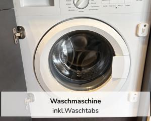 a washing machine with the words washing machine ink washers at Rosels Mountain Lodge - Ferienwohnung mit Schwimmbad, Sauna & Bergblick - Oberaudorf Bayern in Oberaudorf