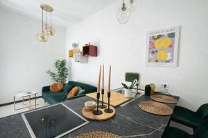a living room with a table and a couch at Hotiday Rapallo Old Town in Rapallo