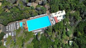 an overhead view of a swimming pool in a park at Camping Bella Sardinia in S'archittu Cuglieri