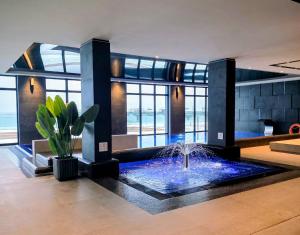 a living room with a fountain in the middle at Baltic Infinity Suite 529 - SPA & Pool Access in Międzyzdroje +68 photos