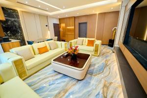 a living room with a couch and a table at Dembesh Hotel Juba in Juba