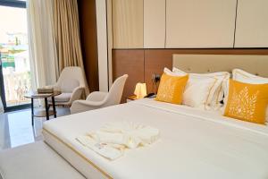 a hotel room with a bed with a towel on it at Dembesh Hotel Juba in Juba +35 photos