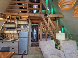 a tiny house with a kitchen and a staircase at DREAM house by the sea in COCOland in Epanomi