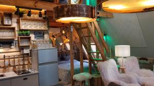 a room with a kitchen with a ladder and chairs at DREAM house by the sea in COCOland in Epanomi +76 photos