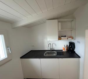 a kitchen with a sink and a counter top at B&B Sant'Angelo Sala Consilina in Sala Consilina